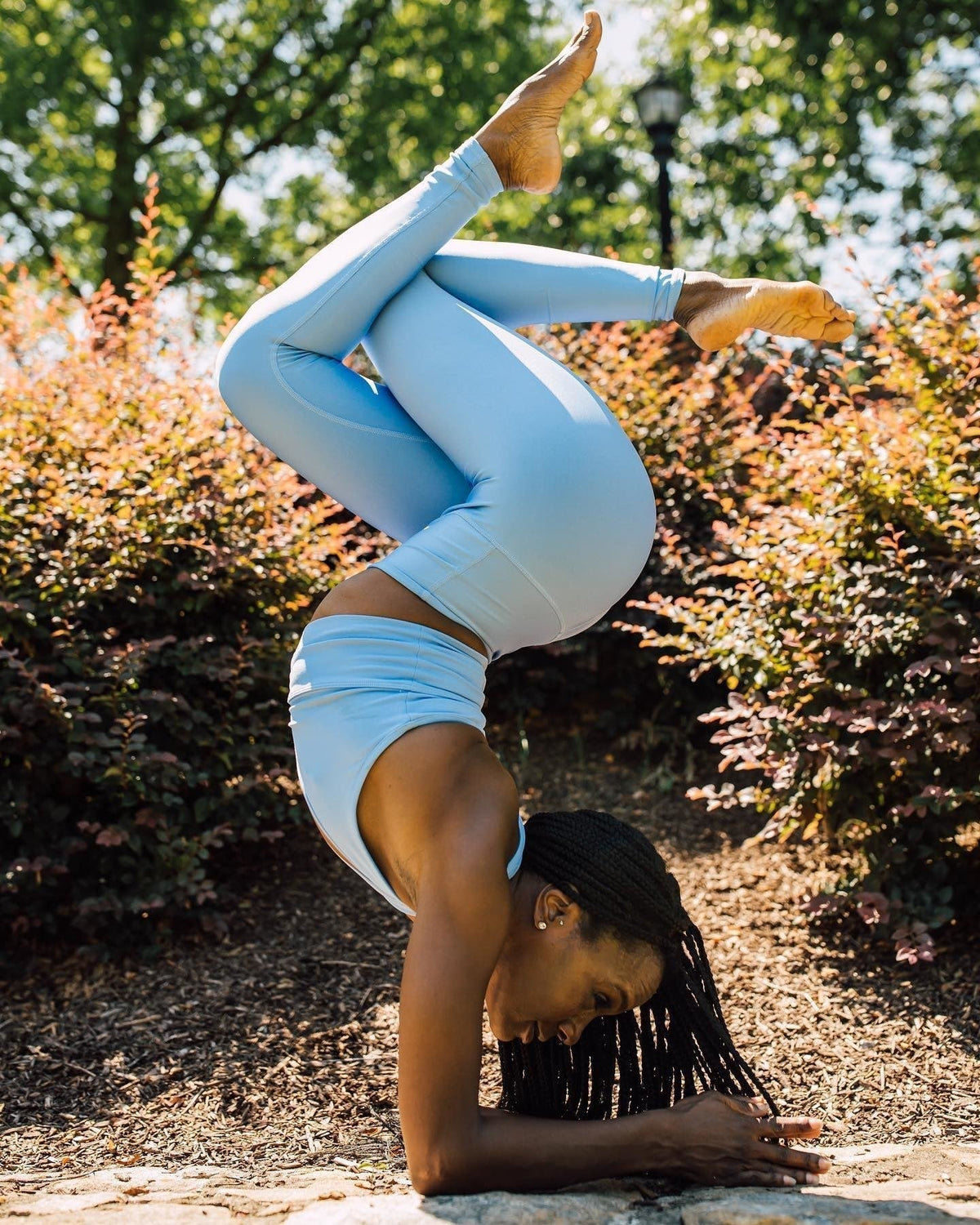 Yogi Tie Simpson performs a forearm balance.