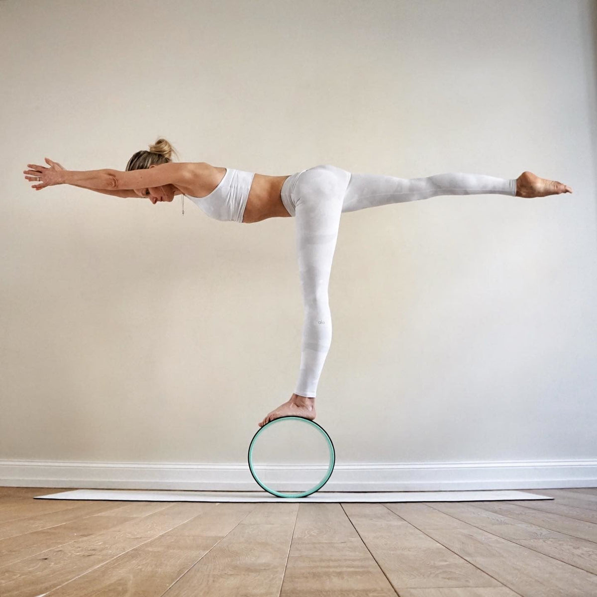 @ania_75 wearing White Camouflage Vapor Leggings with a matching White Camouflage Vapor Wild Thing Bra during her yoga practice.